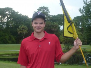 Chris Miller with TPI shirt and flag